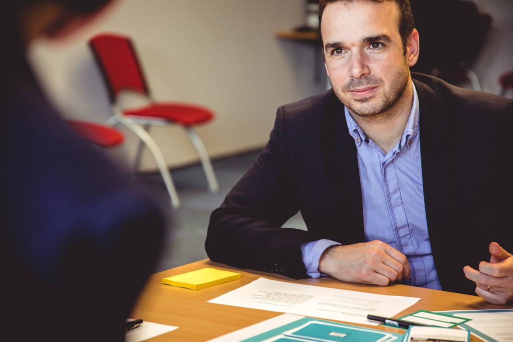 Man at a table with papers on it